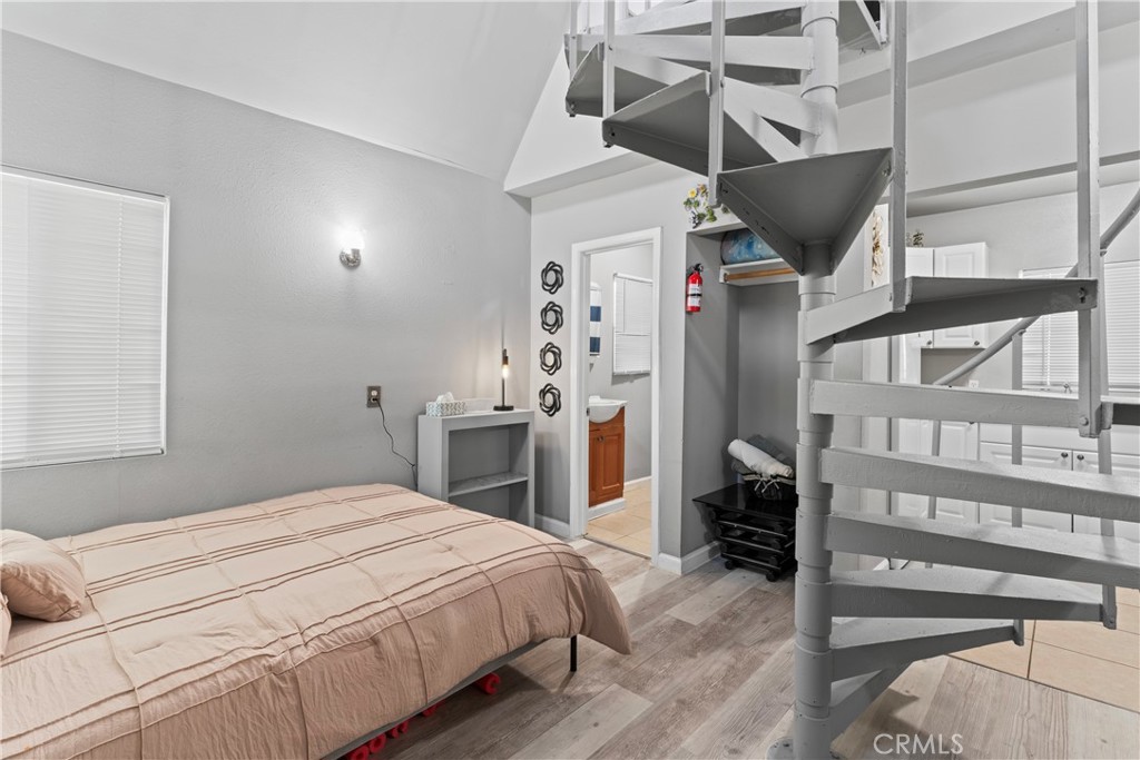 1286 Lovers Lane Rimforest, CA 92378 - Photo 3 of 27 a bedroom with a bed and a closet