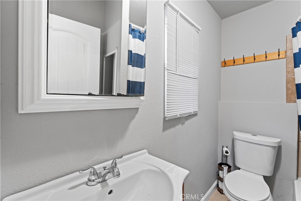 1286 Lovers Lane Rimforest, CA 92378 - Photo 4 of 27 a bathroom with a sink and a mirror