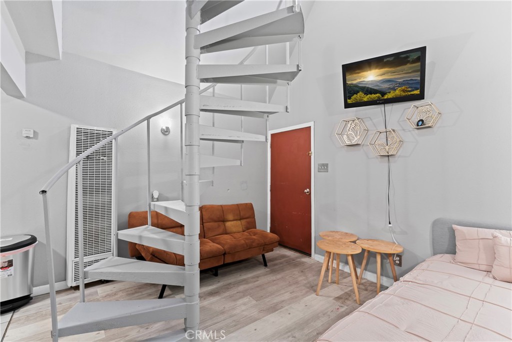 1286 Lovers Lane Rimforest, CA 92378 - Photo 5 of 27 a living room with furniture a flat screen tv and outdoor view