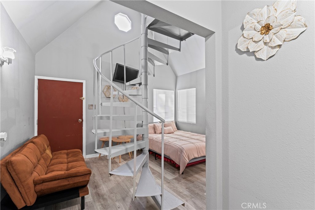 1286 Lovers Lane Rimforest, CA 92378 - Photo 7 of 27 a bedroom with furniture and wooden floor