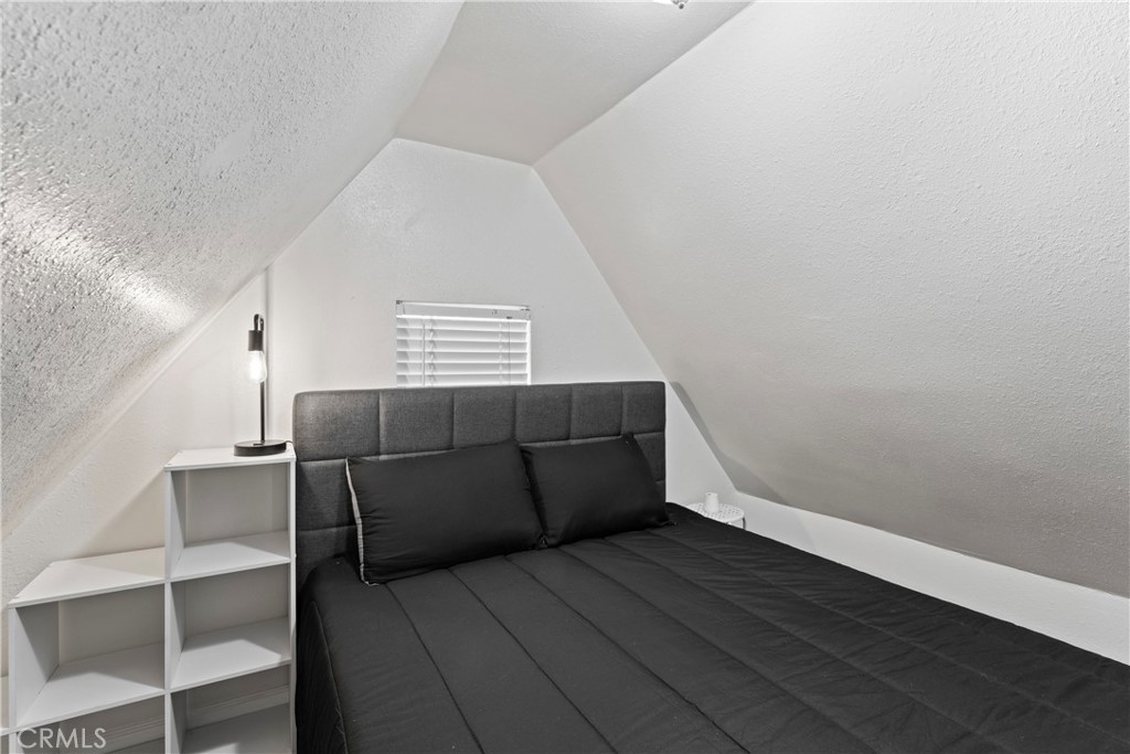 1286 Lovers Lane Rimforest, CA 92378 - Photo 8 of 27 a view of wooden floor and windows in a room