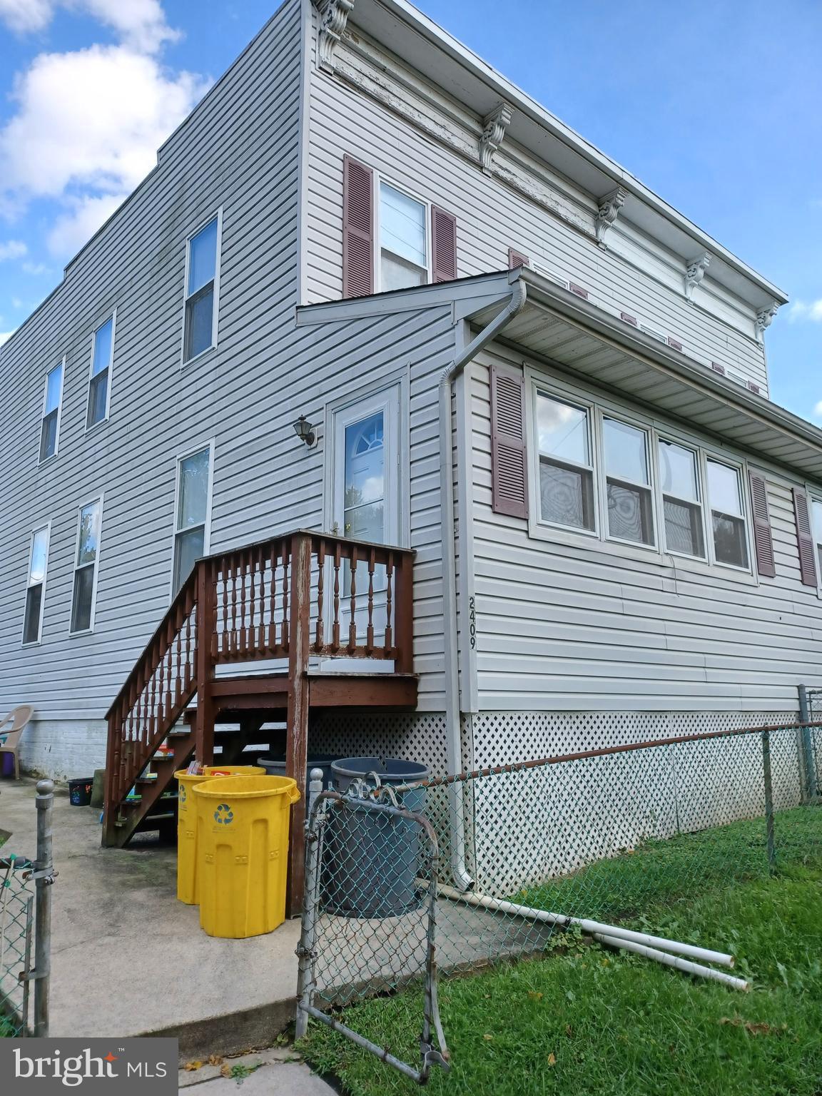 2409 Hammonds Ferry Road Halethorpe, MD 21227 - Photo 1 of 10 a view of a house with wooden deck and furniture