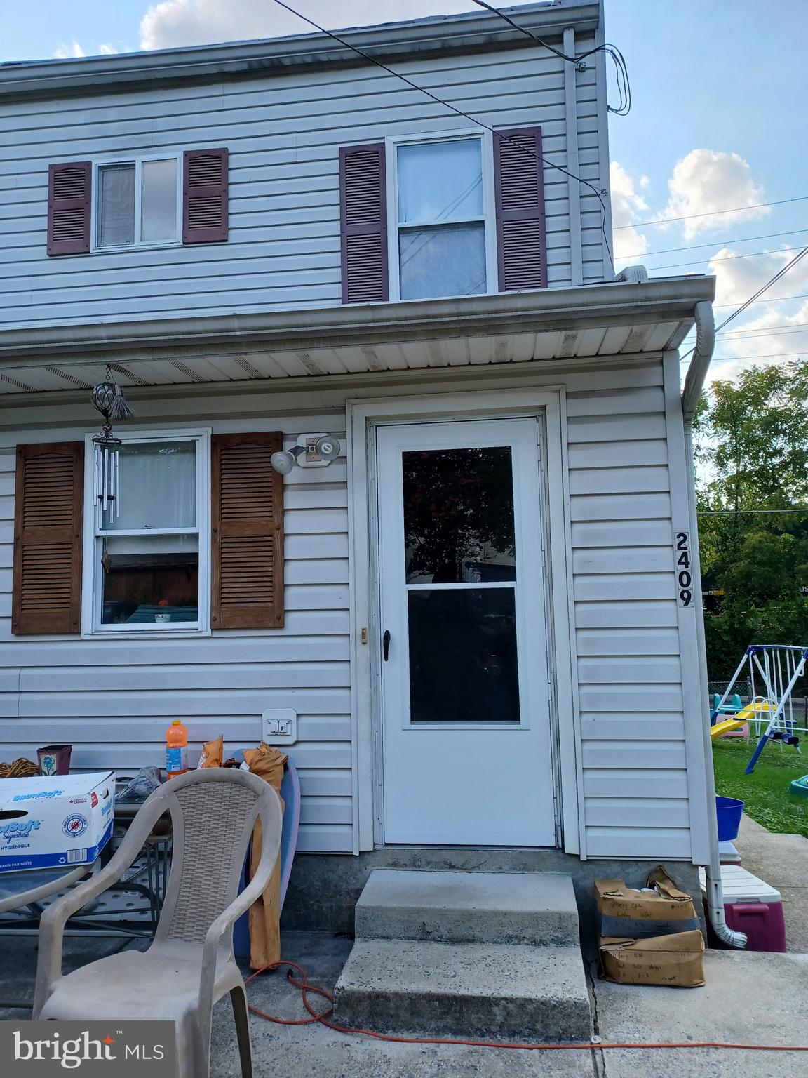 2409 Hammonds Ferry Road Halethorpe, MD 21227 - Photo 2 of 10 a view of a house with a bench in patio