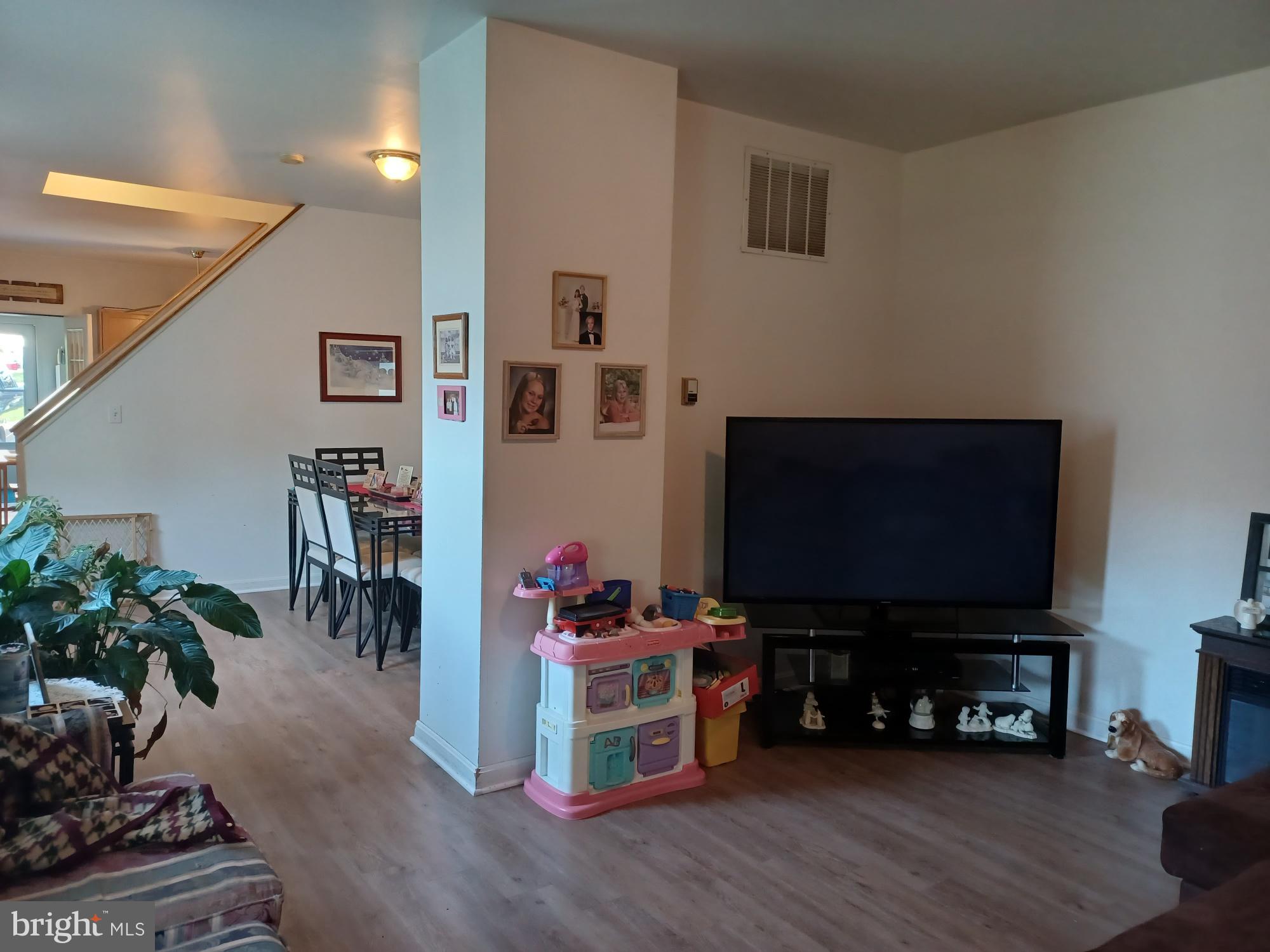 2409 Hammonds Ferry Road Halethorpe, MD 21227 - Photo 5 of 10 a living room with furniture and a flat screen tv
