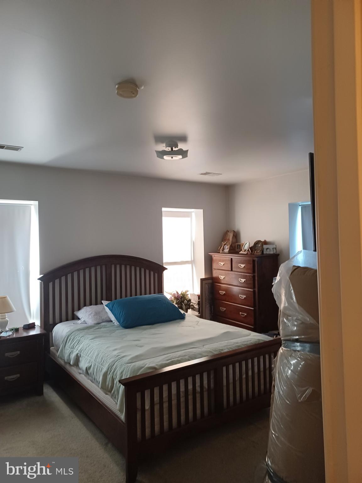 2409 Hammonds Ferry Road Halethorpe, MD 21227 - Photo 8 of 10 a bedroom with a bed and wooden floor