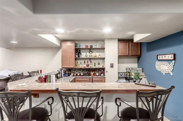 a kitchen with stainless steel appliances a sink and a refrigerator