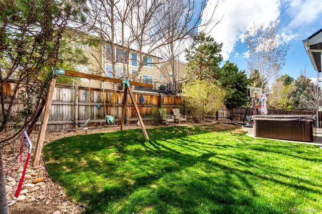 a view of a backyard with sitting area
