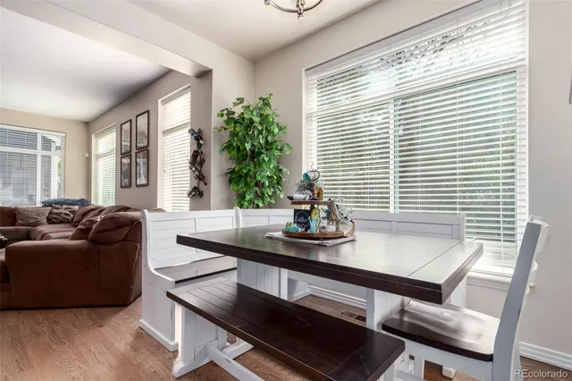 a view of a dining room with furniture and window