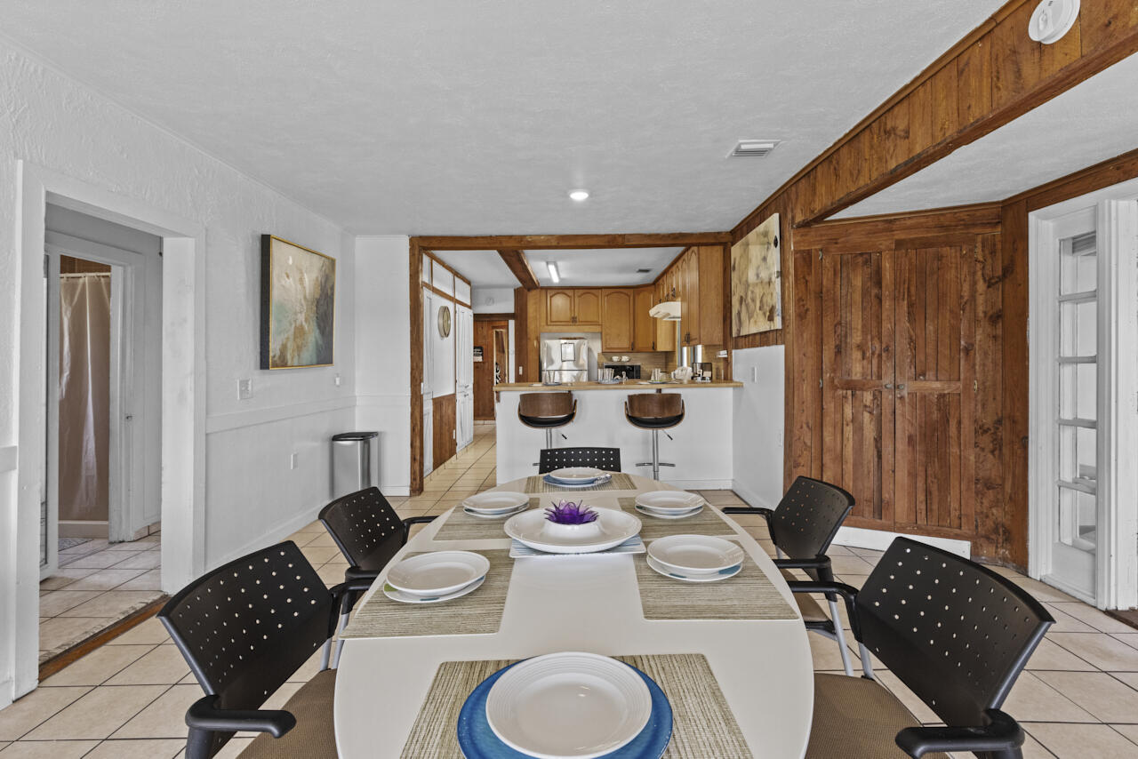 14601 Orange Avenue Fort Pierce, FL 34945 - Photo 11 of 37 a table and chairs in a room