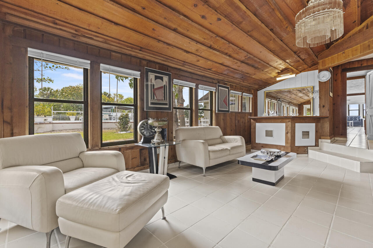 14601 Orange Avenue Fort Pierce, FL 34945 - Photo 21 of 37 a living room with furniture and a large window