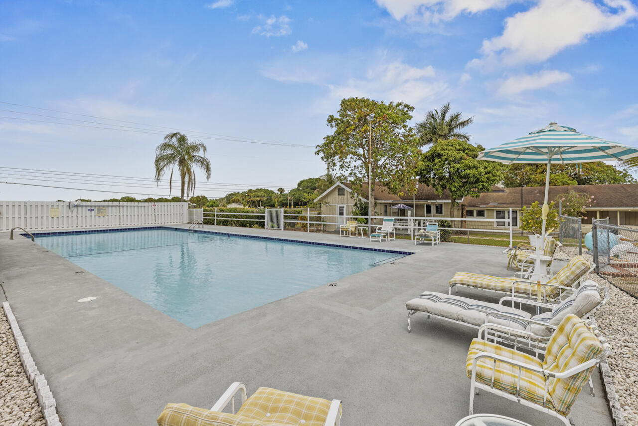 14601 Orange Avenue Fort Pierce, FL 34945 - Photo 24 of 37 a view of a swimming pool with an outdoor seating