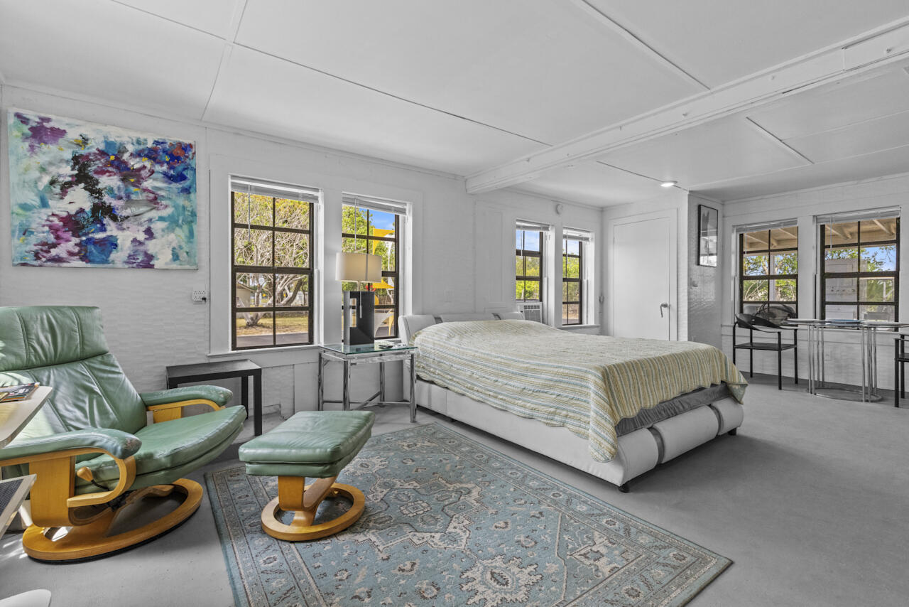 14601 Orange Avenue Fort Pierce, FL 34945 - Photo 29 of 37 a spacious bedroom with a bed and a window