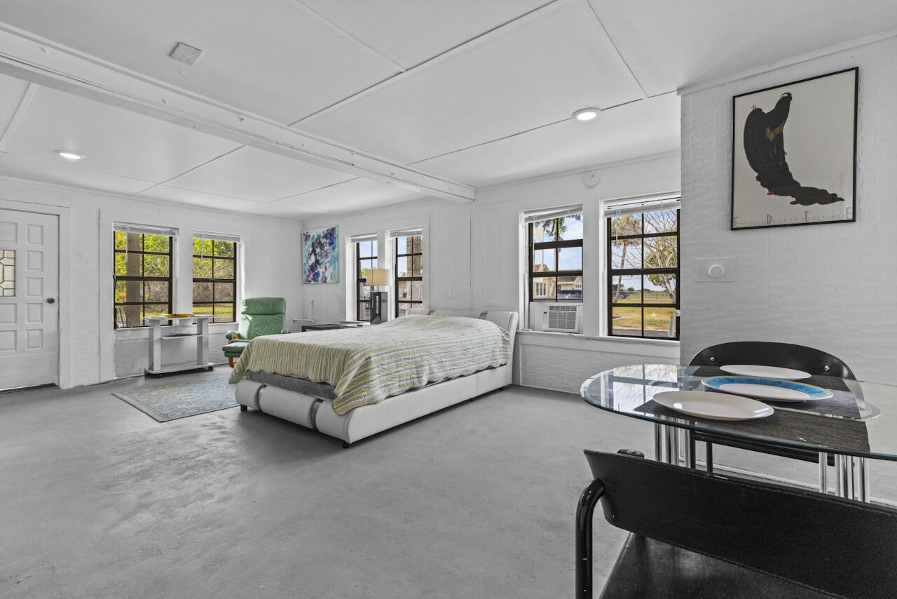 14601 Orange Avenue Fort Pierce, FL 34945 - Photo 31 of 37 a bed room with a bed and a chair