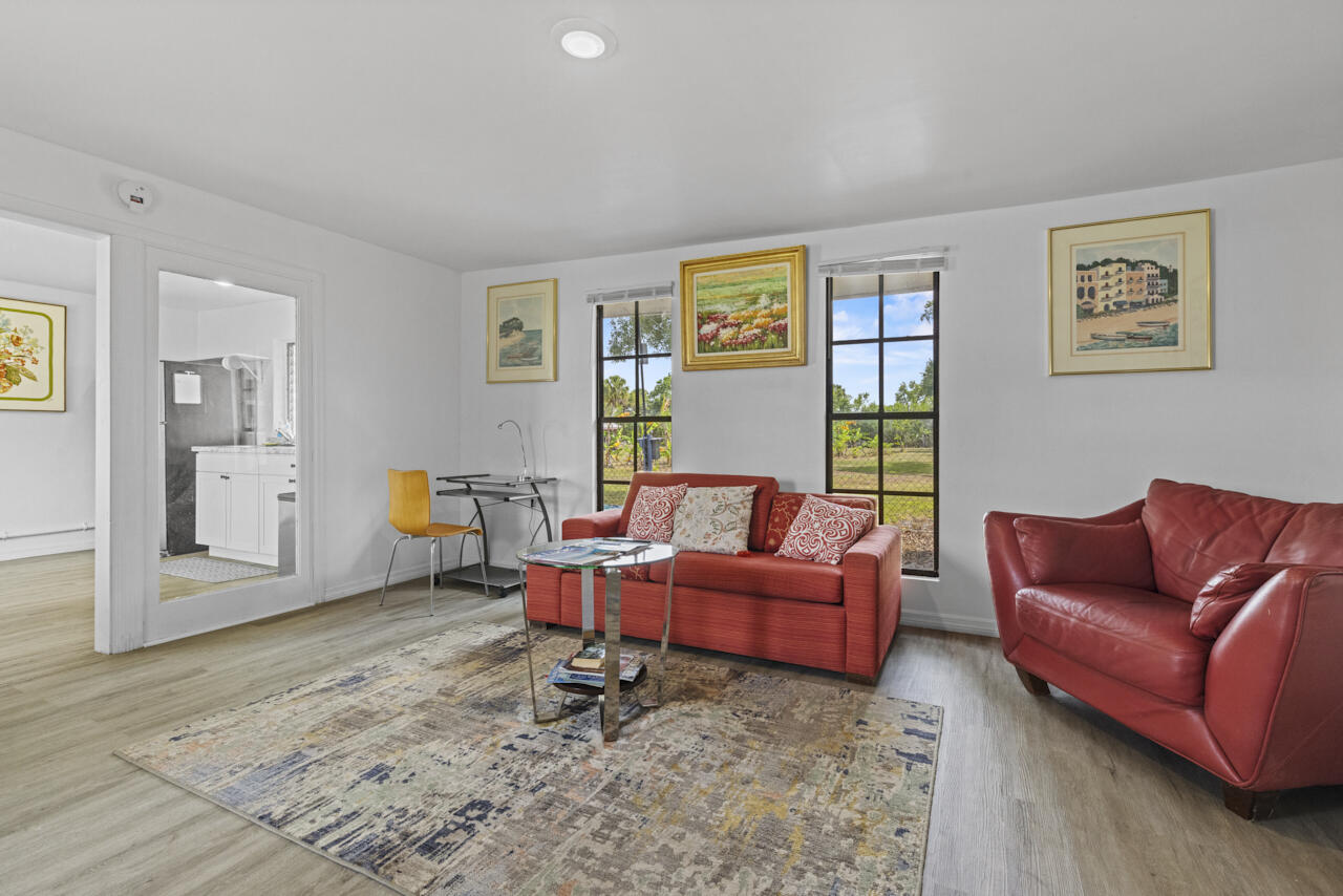 14601 Orange Avenue Fort Pierce, FL 34945 - Photo 34 of 37 a living room with furniture window and a table