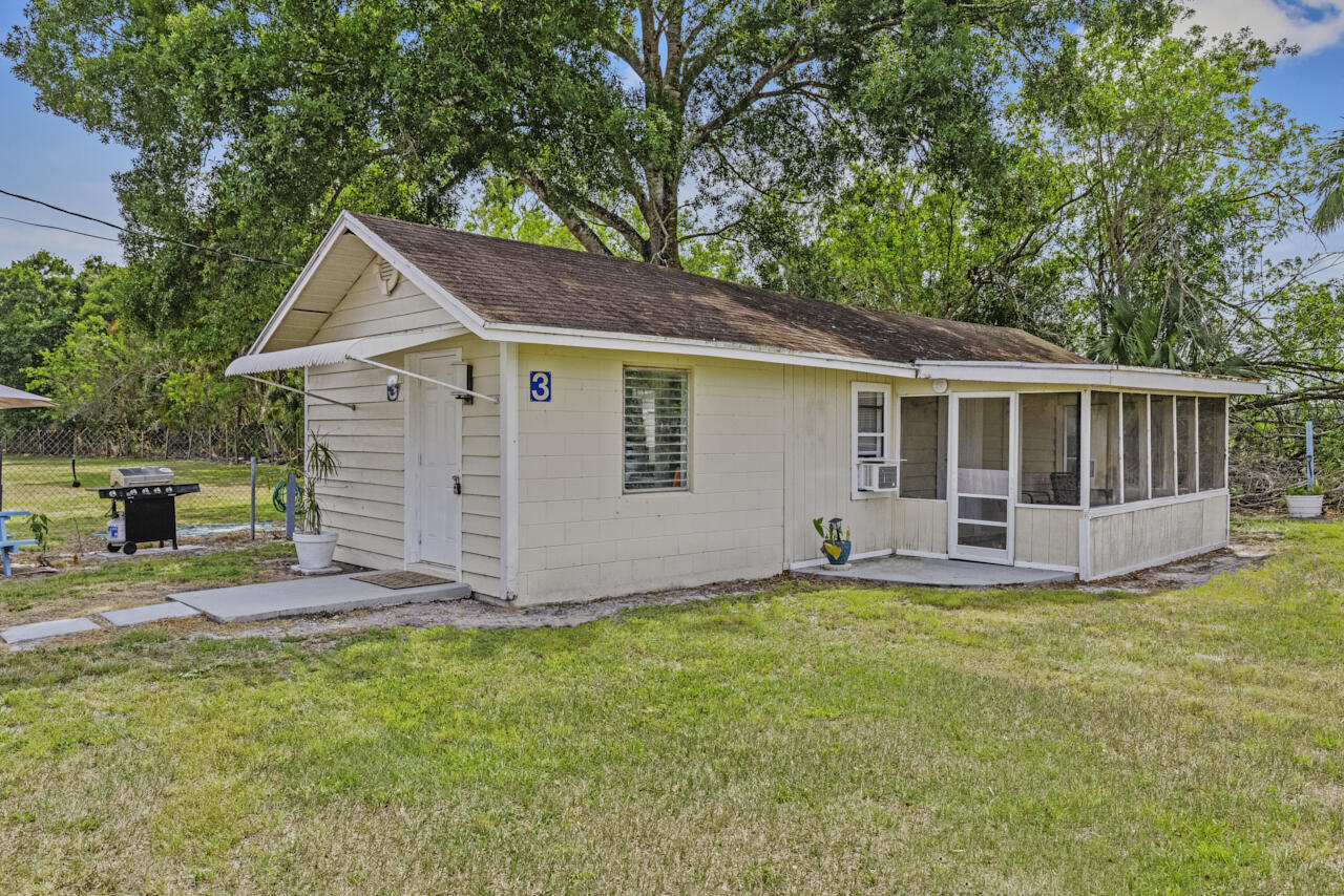 14601 Orange Avenue Fort Pierce, FL 34945 - Photo 6 of 37 a view of a house with a yard