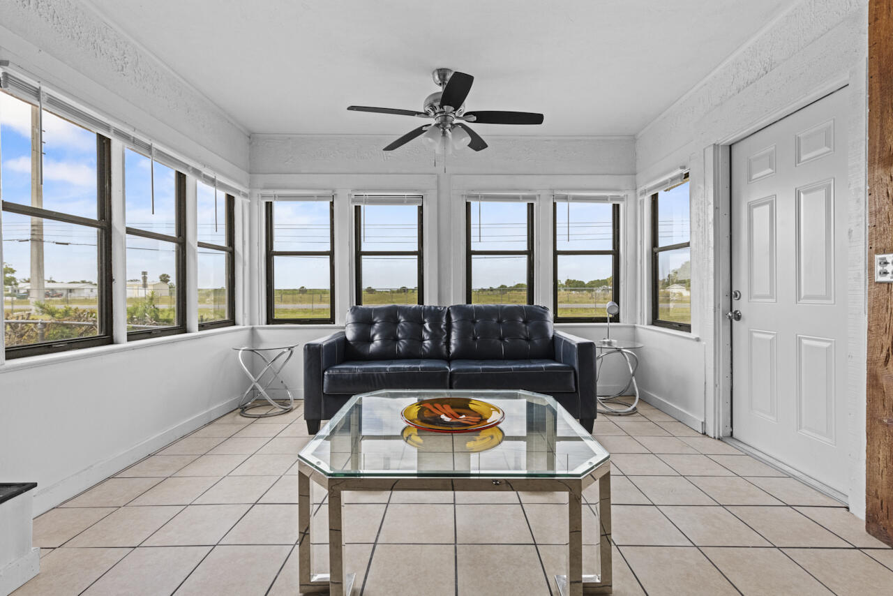 14601 Orange Avenue Fort Pierce, FL 34945 - Photo 9 of 37 a view of living room filled with furniture and a window