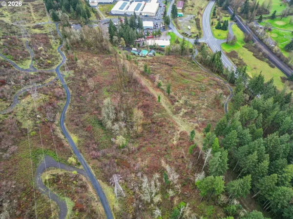 an aerial view of a residential houses with outdoor space