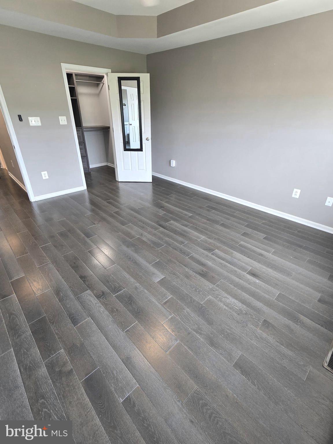 11847 Skylark Road Clarksburg, MD 20871 - Photo 35 of 46 a view of an empty room with window and wooden floor
