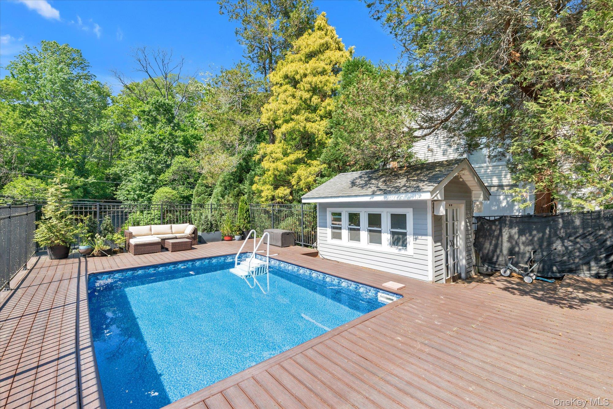80 Skunks Misery Road Locust Valley, NY 11560 - Photo 24 of 25 a view of a house with pool and sitting area