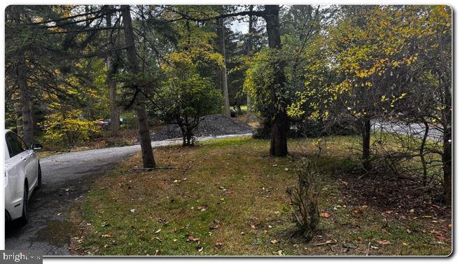 4759 Sheeprock Road Macungie, PA 18062 - Photo 11 of 24 Serene autumn landscape with winding path.