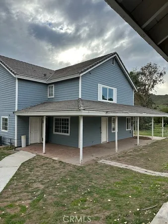 a house view with a garden space