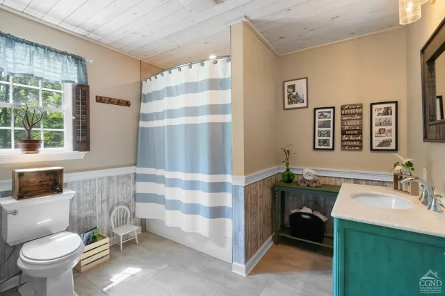 a living room with furniture window and a flat screen tv