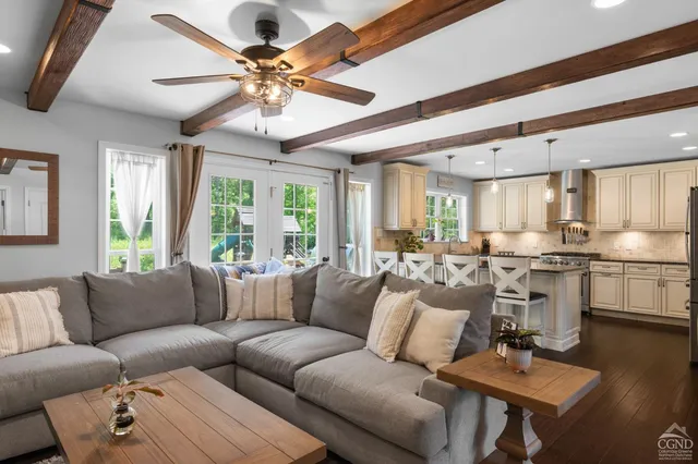 a living room with furniture and a large window