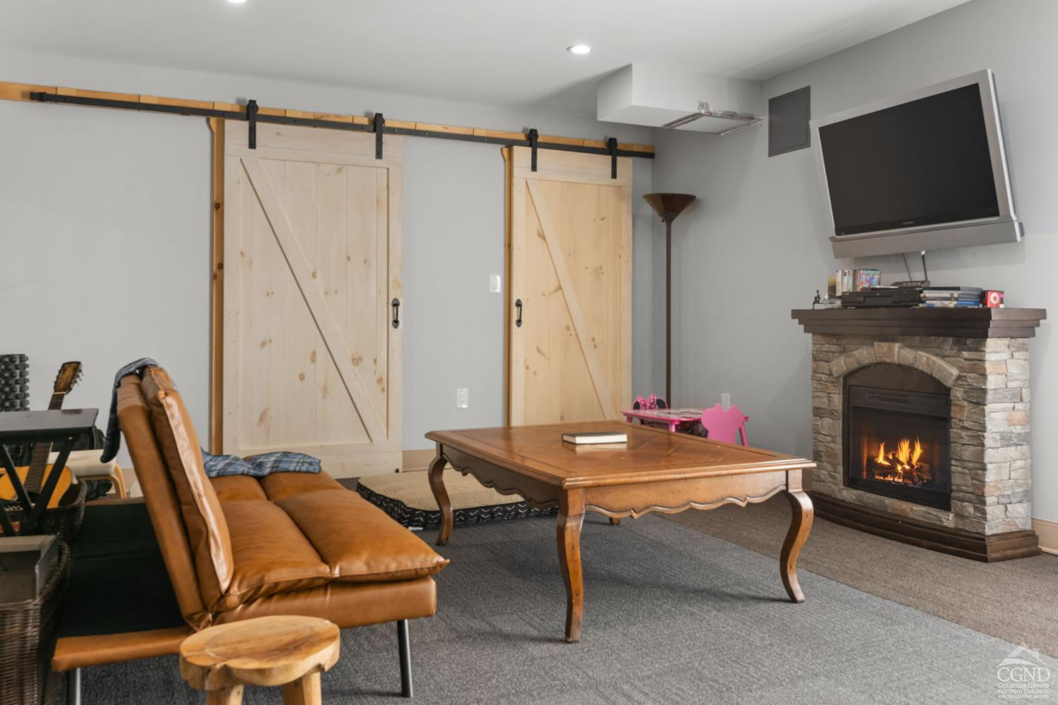 174 Grove School Road Catskill, NY 12414 - Photo 32 of 52 a living room with furniture a flat screen tv and a fireplace