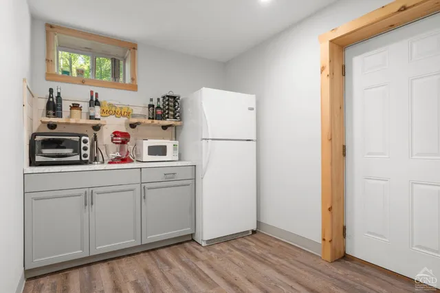 a view of hallway with wooden floor