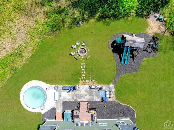 a view of a two chairs in a yard