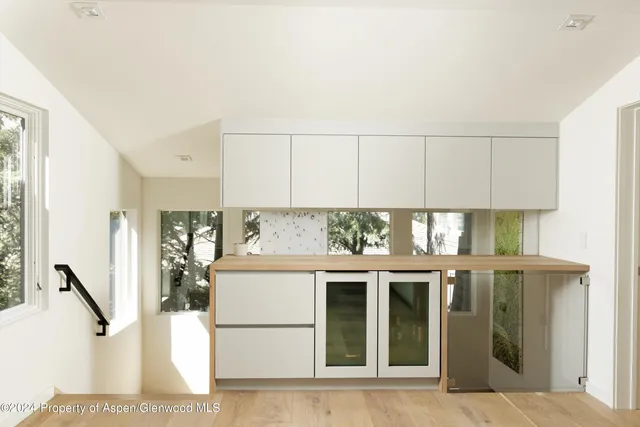 a view of a kitchen with an oven and refrigerator