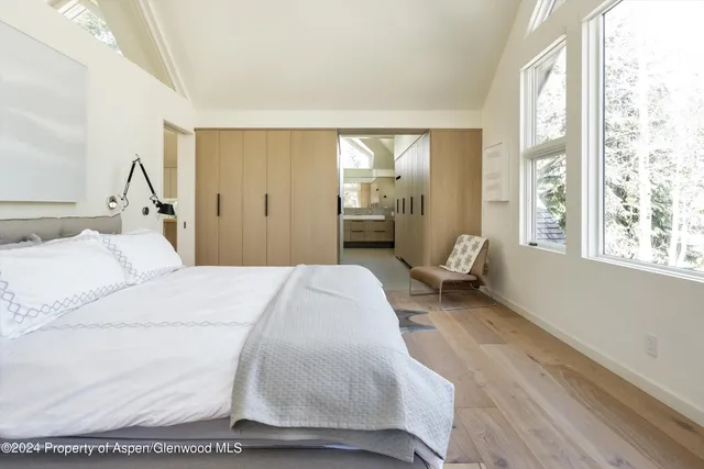 a bedroom with a bed and window