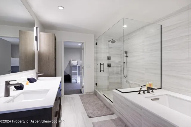 a bathroom with a bathtub and a sink