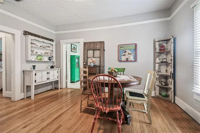 a kitchen with kitchen island granite countertop a sink cabinets and window