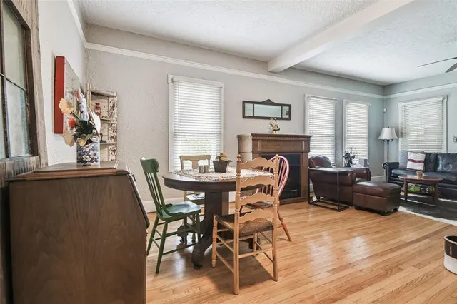 a kitchen with stainless steel appliances granite countertop a sink and a white cabinets