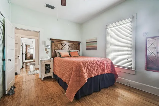 an outdoor sitting area with swimming pool in the back