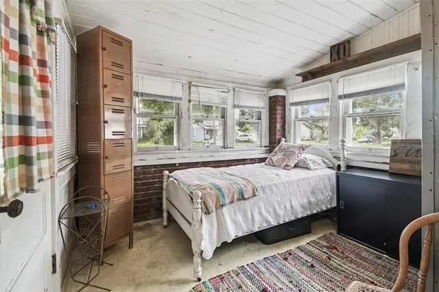 a view of a house with swimming pool and porch with furniture