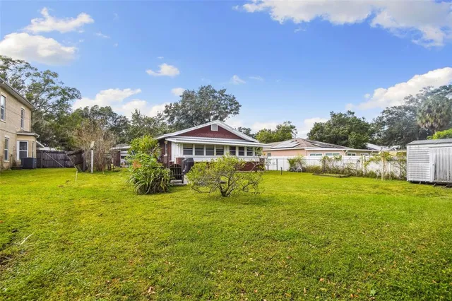 a view of a park with large trees