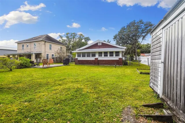 a view of a park with large trees
