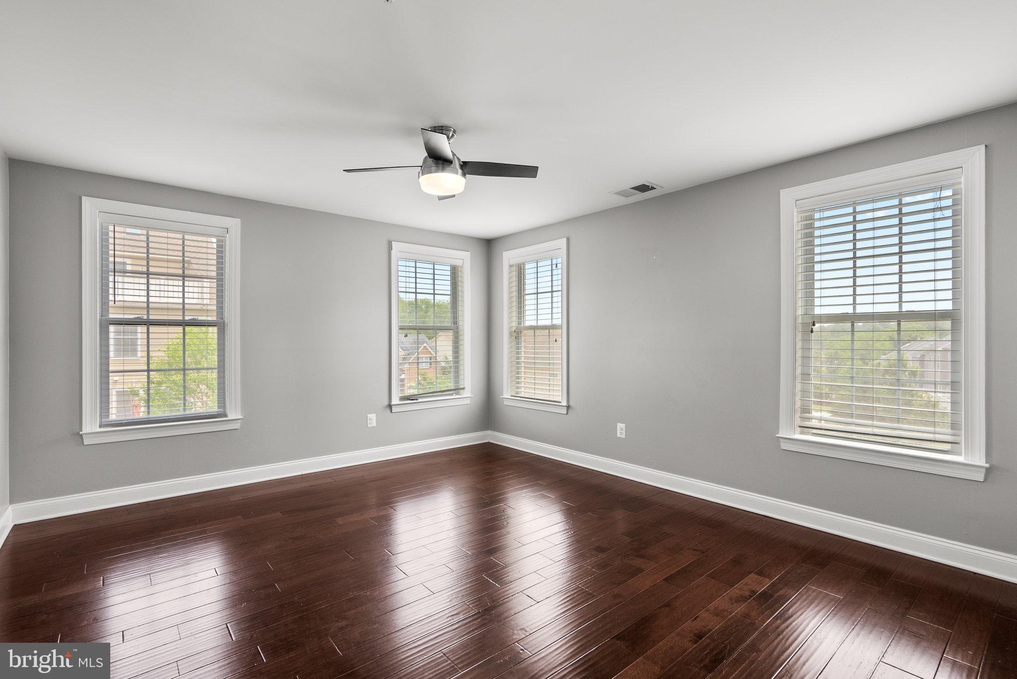 2501 Cherry Tree Road Hanover, MD 21076 - Photo 15 of 30 a view of an empty room with wooden floor and a window