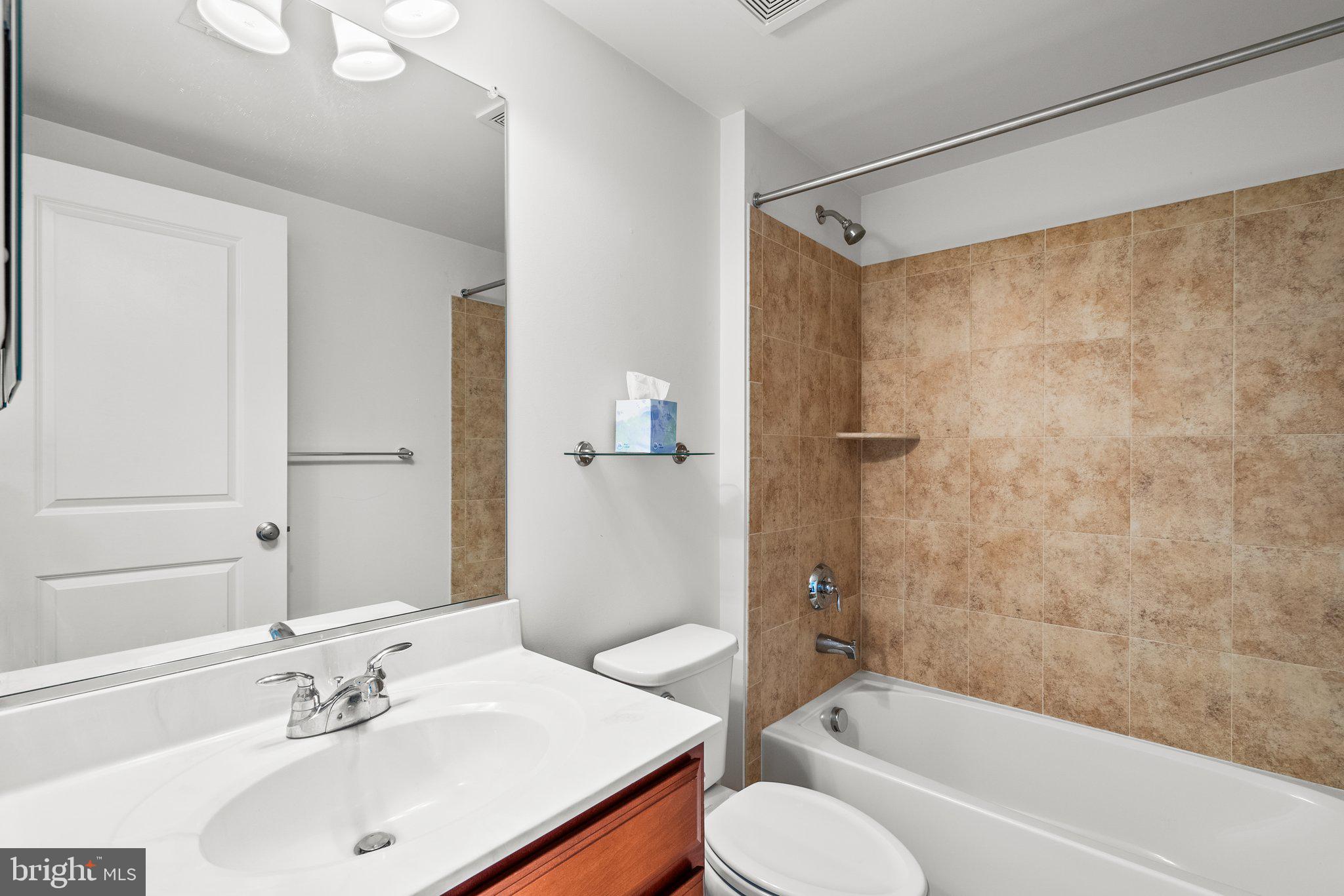 2501 Cherry Tree Road Hanover, MD 21076 - Photo 21 of 30 a bathroom with a sink toilet and shower