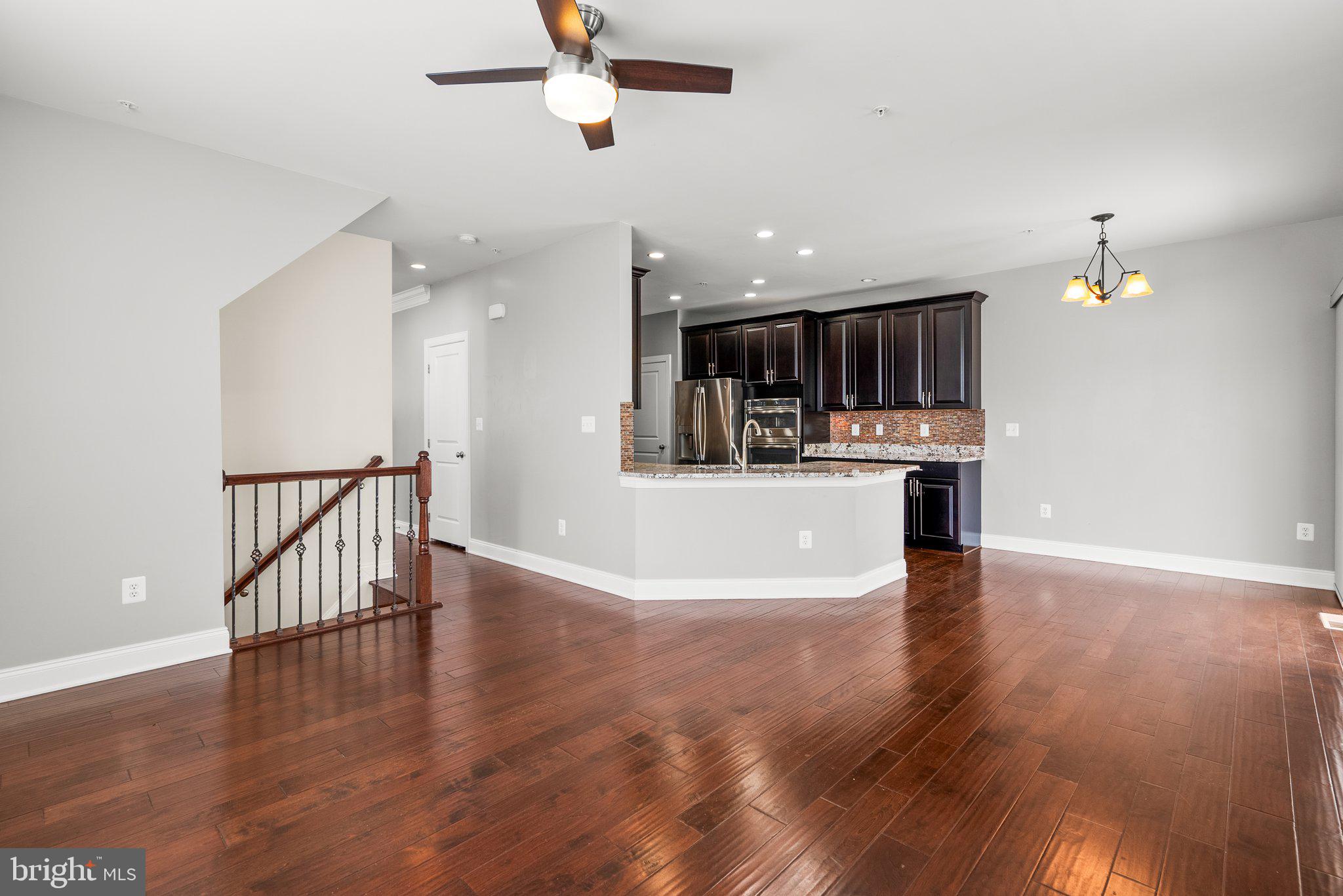 2501 Cherry Tree Road Hanover, MD 21076 - Photo 8 of 30 a view of kitchen with microwave and wooden floor