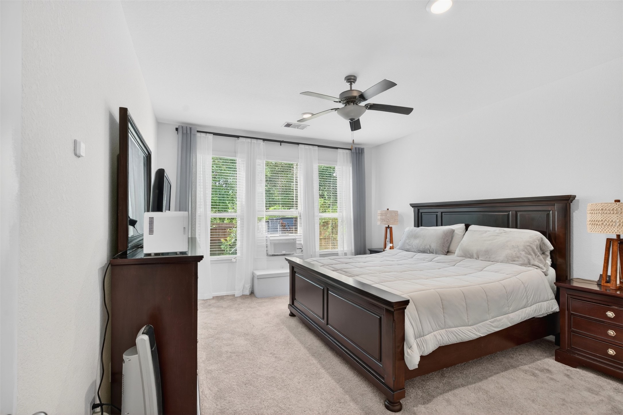 2832 Mistygate Court Conroe, TX 77301 - Photo 14 of 50 Spacious primary bedroom located on the 1st floor offering a relaxing retreat with room for large furniture and personal touches.