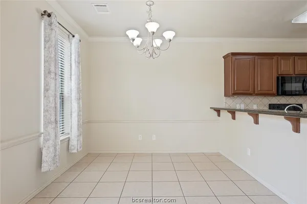 a view of a kitchen with a sink dishwasher and a refrigerator