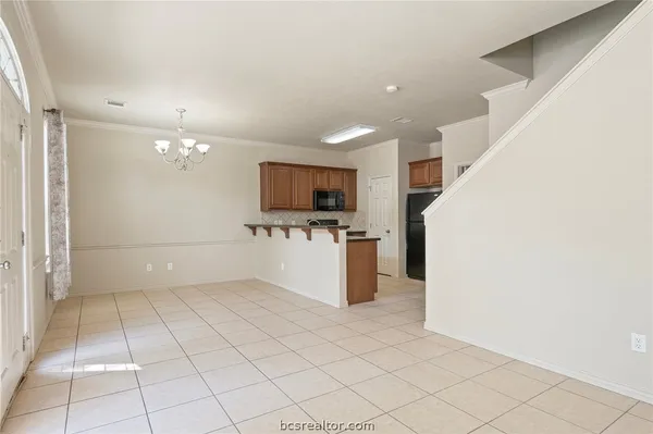 a view of a kitchen with microwave and cabinets