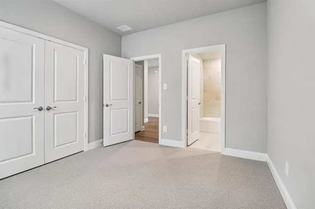 an empty room with closet area