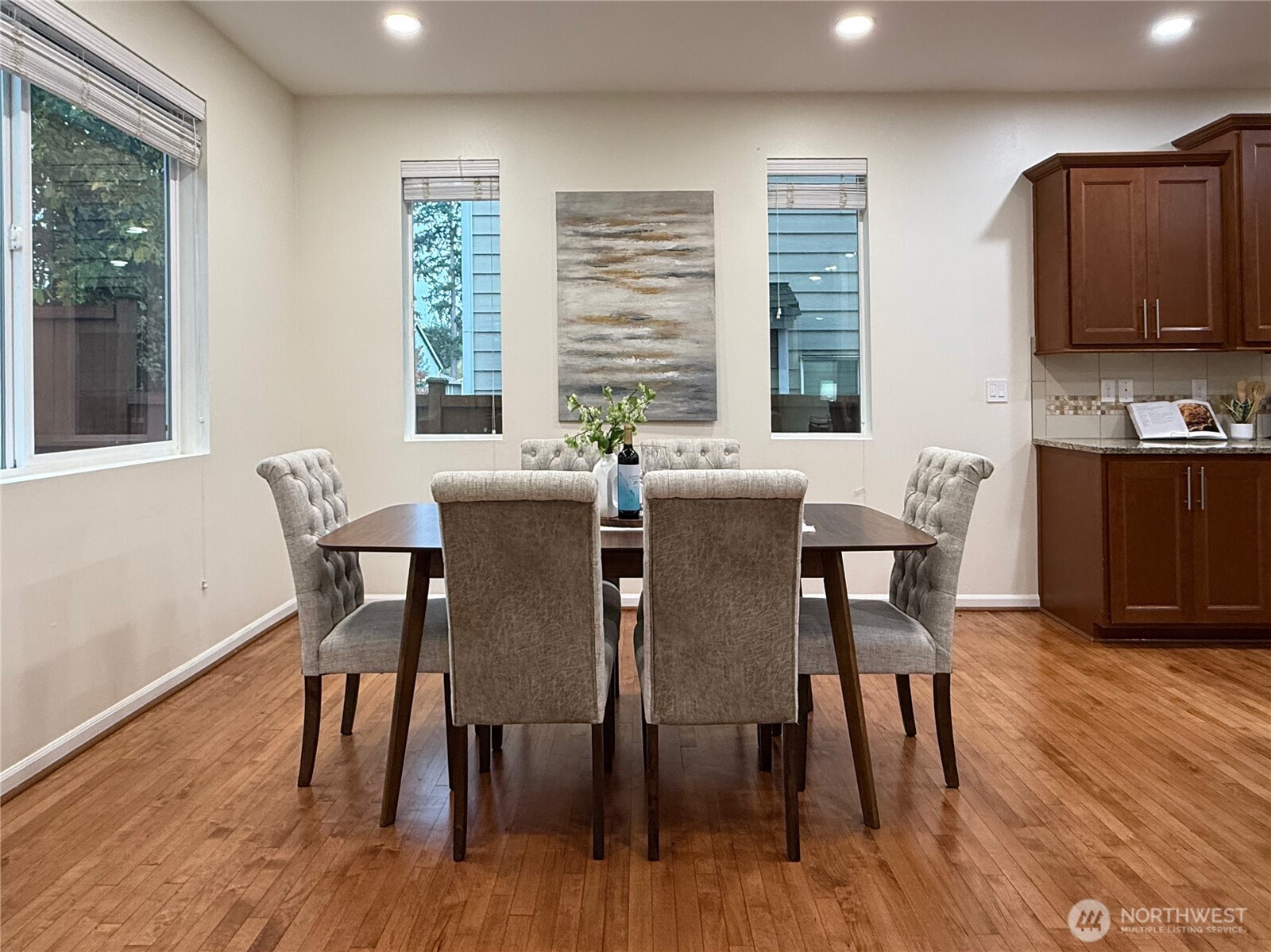 3918 177th Street Southeast Bothell, WA 98012 - Photo 11 of 39 a view of a dining room with furniture and wooden floor