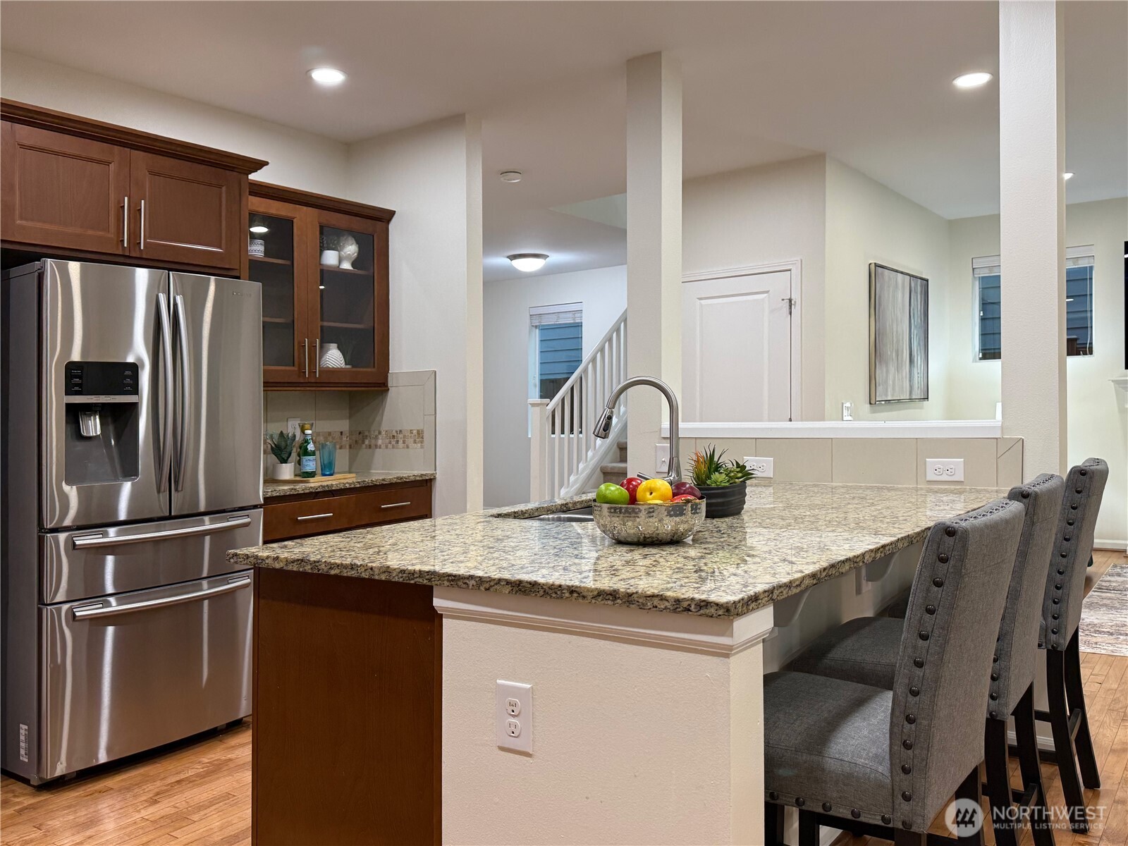 3918 177th Street Southeast Bothell, WA 98012 - Photo 13 of 39 a kitchen with stainless steel appliances granite countertop a sink refrigerator and microwave