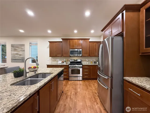 a kitchen with a stove and a cabinets