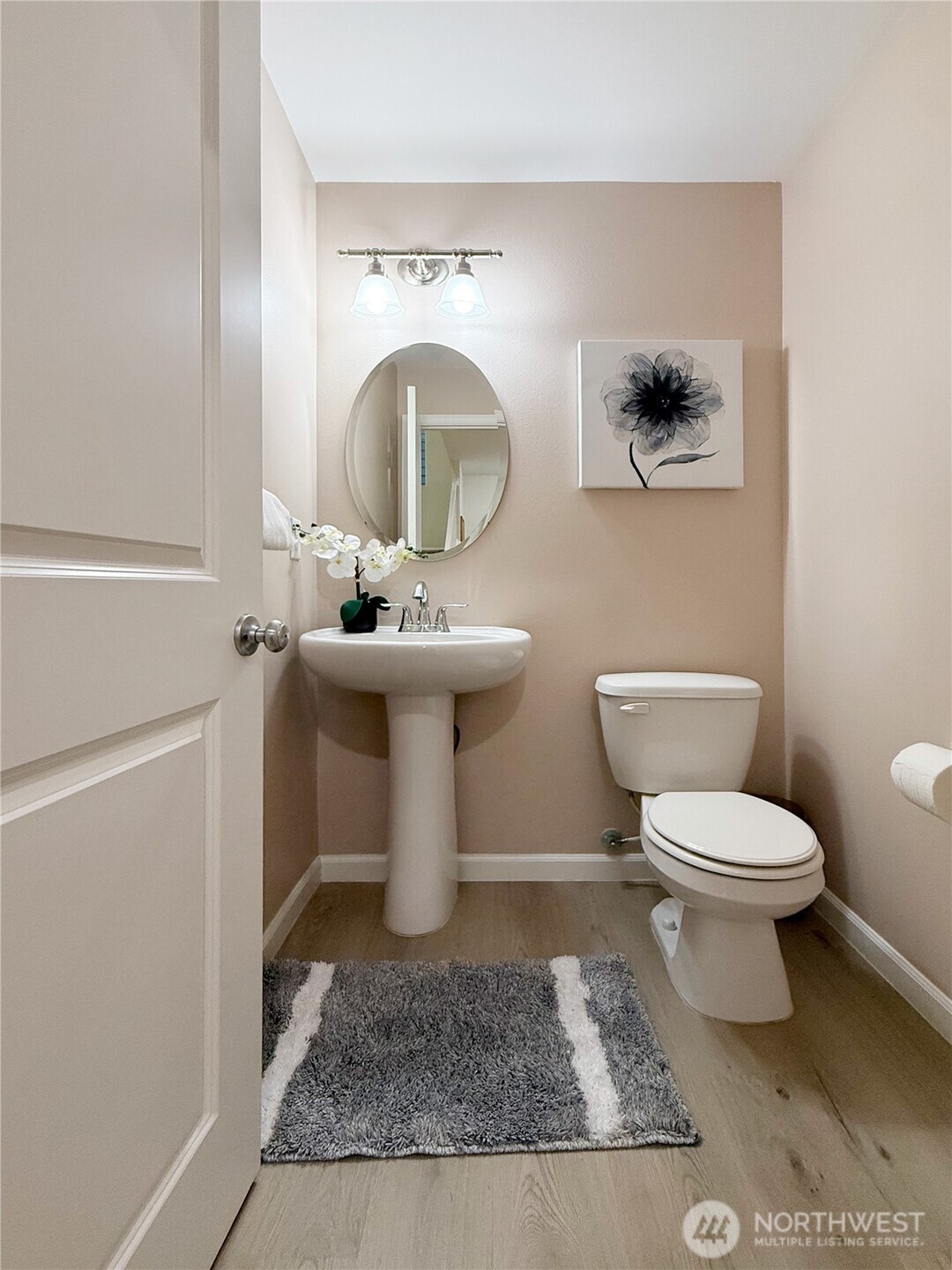 3918 177th Street Southeast Bothell, WA 98012 - Photo 17 of 39 a white toilet sitting next to a bathroom sink